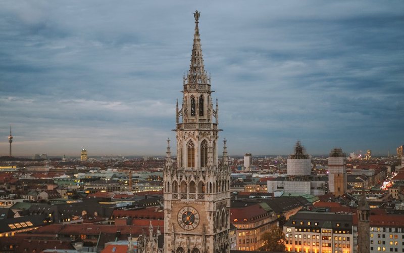 Huge clock tower under the sky in Munich.